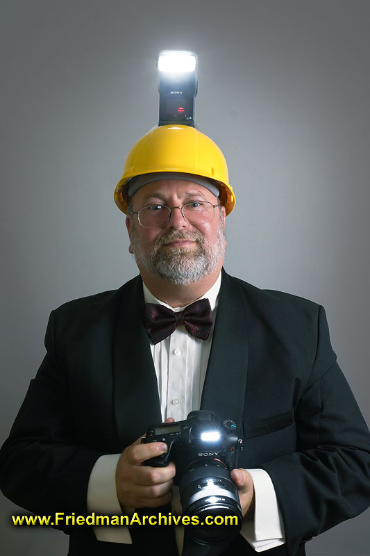 humor,light,photographer,wedding,flash, hard hat, tux, tuxedo,serious,studio,wireless flash,style,dignity,